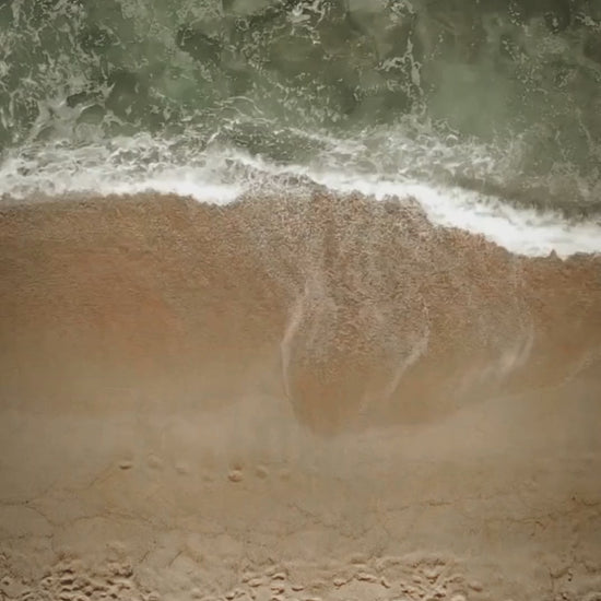 Montage video with waves crashing on beaches, amber, and coriander seeds